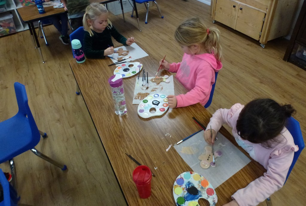 Students paint gingerbread ceramics