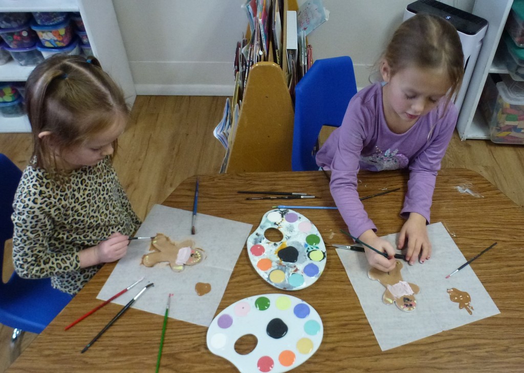 Students paint gingerbread ceramics