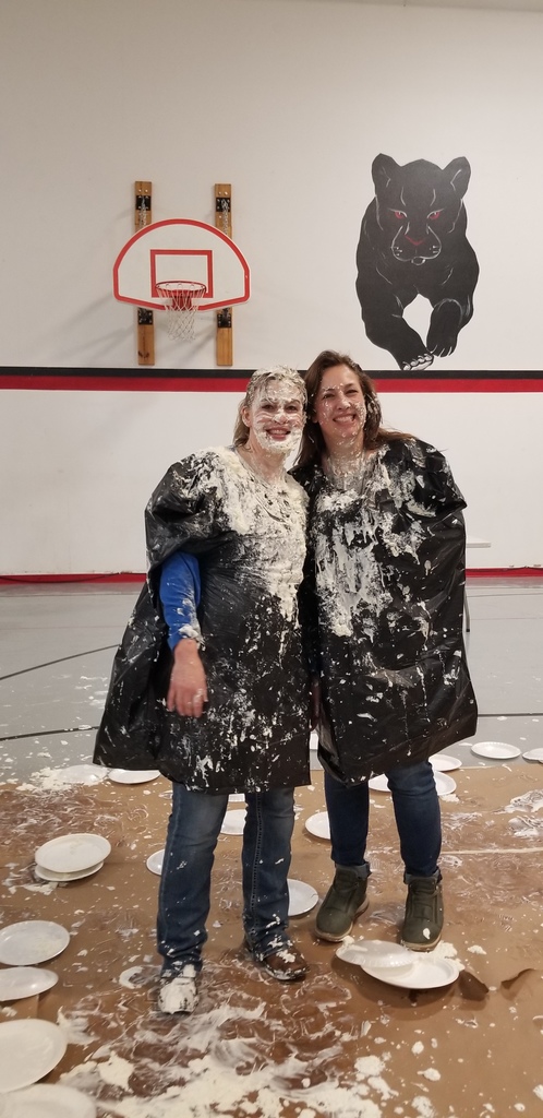 two women covered in whipped cream